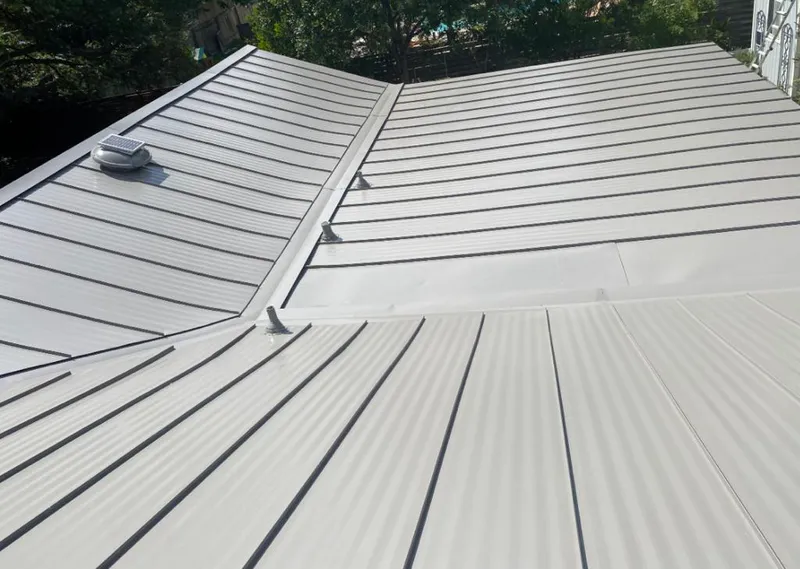 Solar attic fan installed on a metal roof for Roof Ventilation in Aquia Harbour